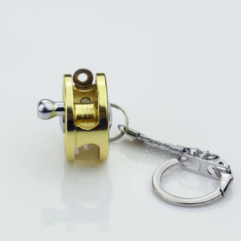 Mini Žuvų Varantys Keychain Aukso Skristi Žvejys Verpimo Charactor Miniatiūriniai Žvejybos Ritės Key Chain Automobilių Paketų Prižiūrėtojų Raktinę Priedai